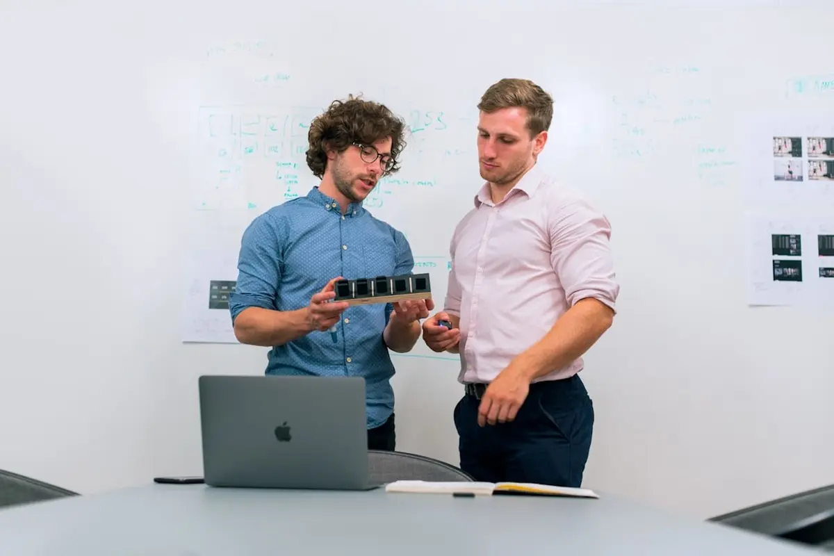 people sitting on chair in front of computer monitor