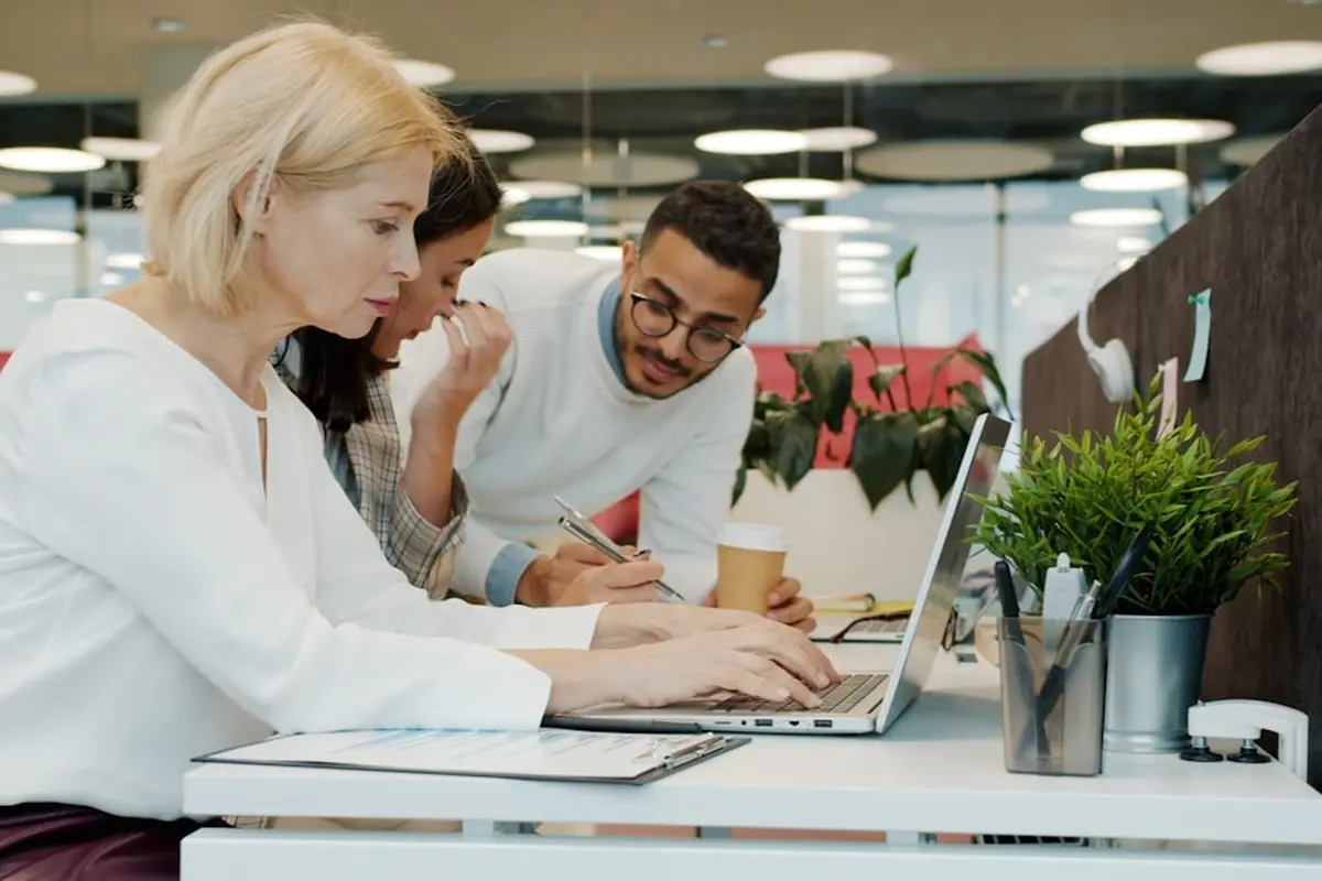 people sitting on chair in front of computer monitor
