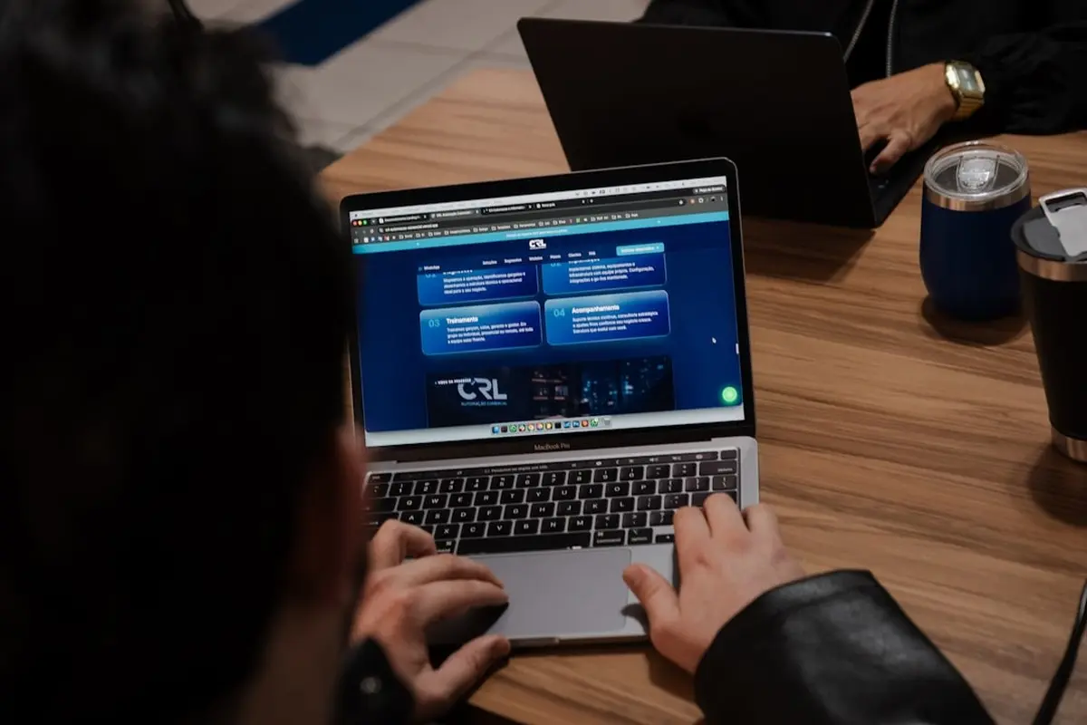 people sitting on chair in front of computer monitor